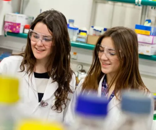 Kids from public engagement program in a lab